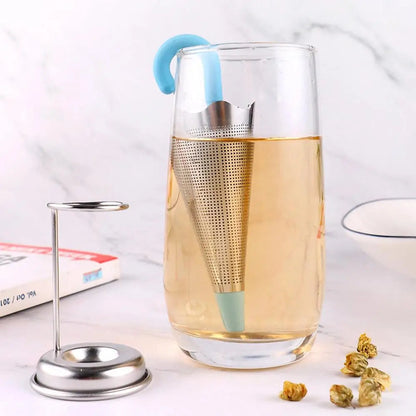 Close-up of stainless steel umbrella infuser filled with loose leaf tea
