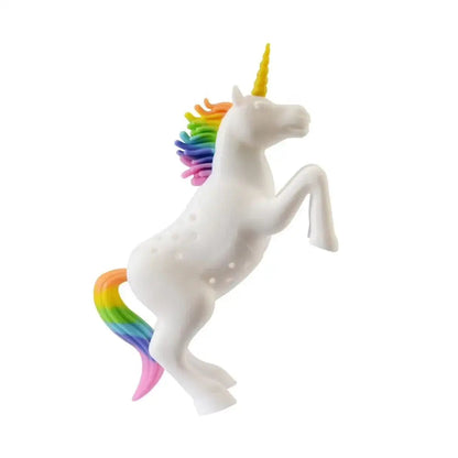 Unicorn tea infuser on a saucer with tea leaves