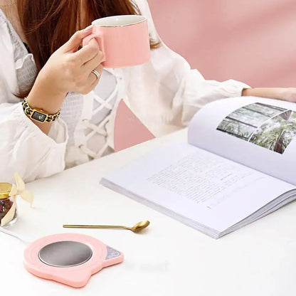 Close-up of USB cat mug warmer showing concave top
