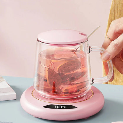 Pink USB mug warmer with a cup of hot tea on top