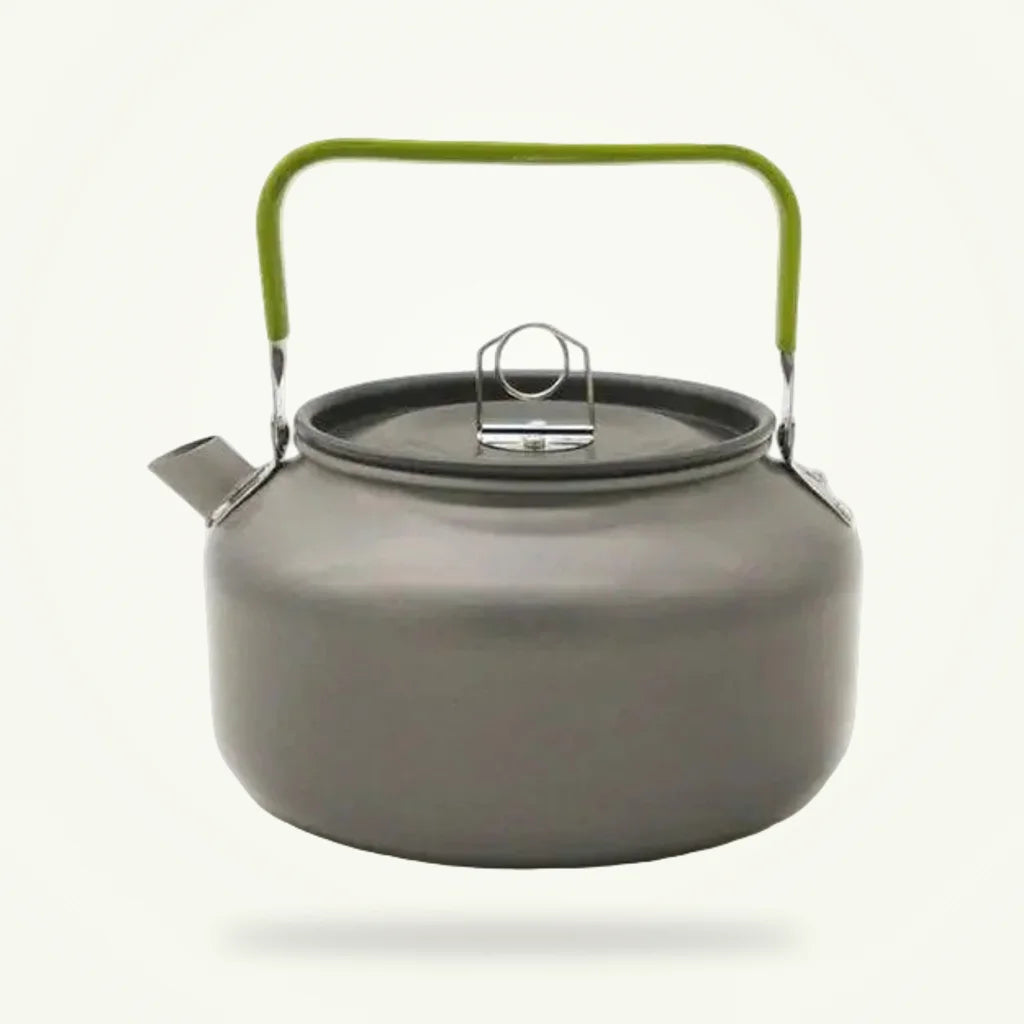 Vintage aluminum tea kettle with green handle 1200 ml on plain background