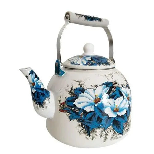Side view of vintage porcelain teapot with blue flowers
