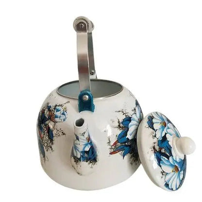 Open lid of vintage porcelain teapot showing capacity