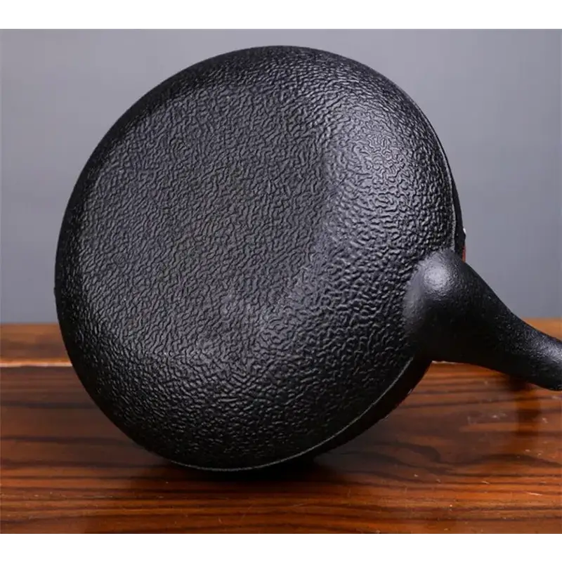 Cast iron teapot with infuser basket