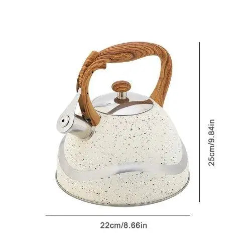 Large vintage cream enamel tea kettle on stovetop