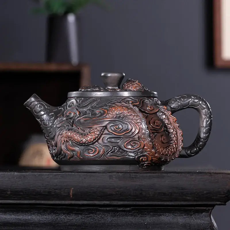 Ceramic teapot with dragon design side angle