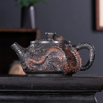 Ceramic teapot with dragon design side angle