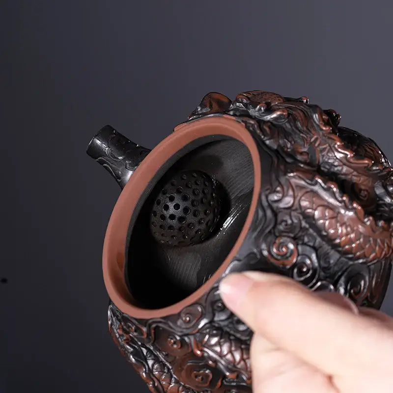 Handcrafted ceramic teapot with dragon handle