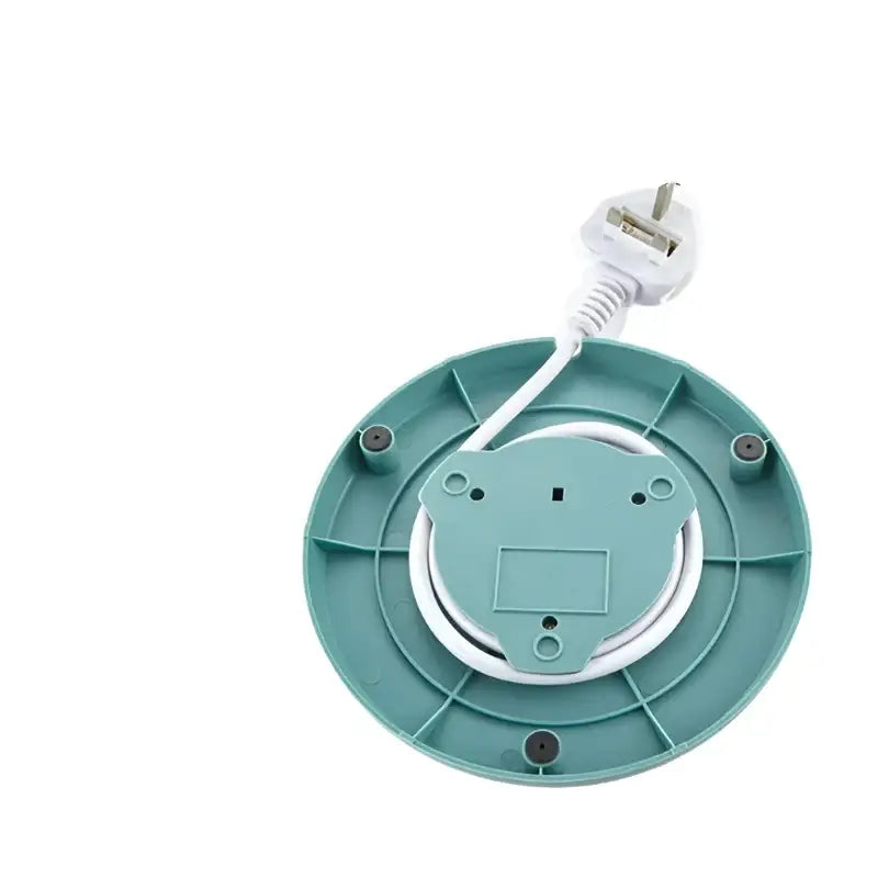 Temperature-controlled electric kettle on kitchen counter with steam rising from spout