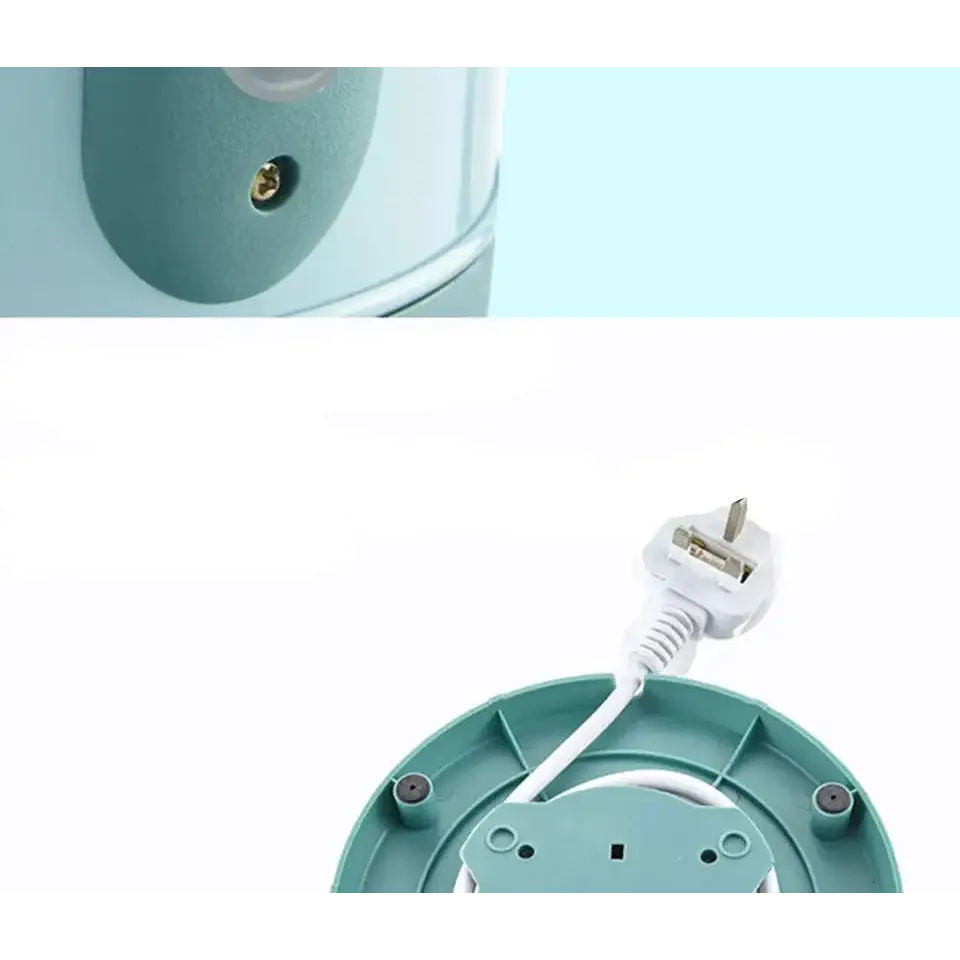 Close-up of vintage electric teapot spout, lid, and retro blue finish detail