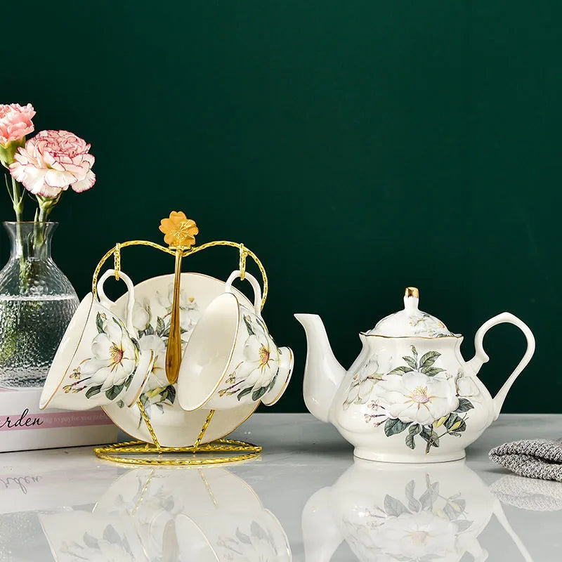 Vintage floral porcelain teapot on gold display stand, English heritage style