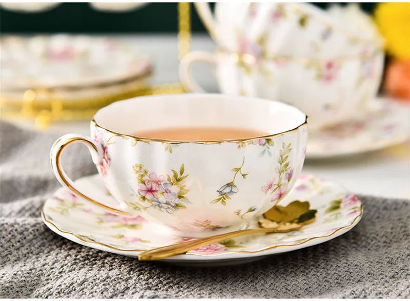 Vintage English porcelain teapot with rose floral pattern and gold accent trim