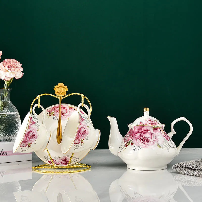 Elegant vintage porcelain teapot with gold handle and hand-painted floral design