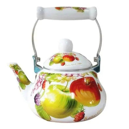 Vintage fruit porcelain tea kettle with matching teacups on a table