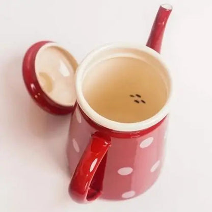 Inside view of red polka dot kettle showing smooth enamel interior