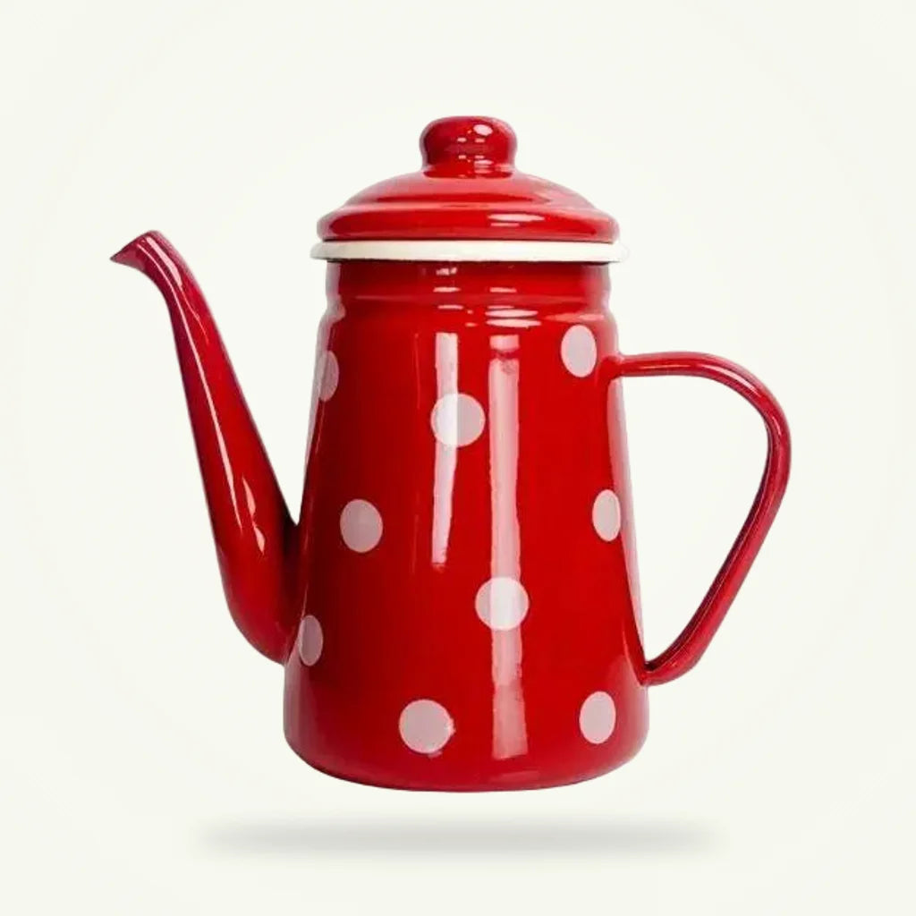 Vintage red polka dot enamel tea kettle 1100 ml on plain background