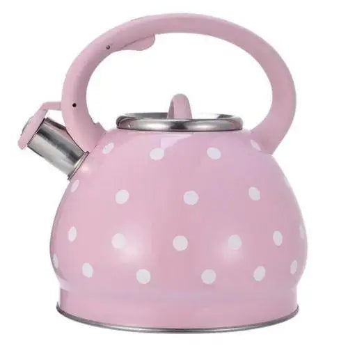 Vintage rose teapot with white polka dots on stovetop