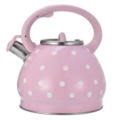 Vintage rose teapot with white polka dots on stovetop