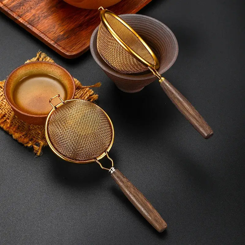 Vintage stainless steel tea strainer with wooden handle