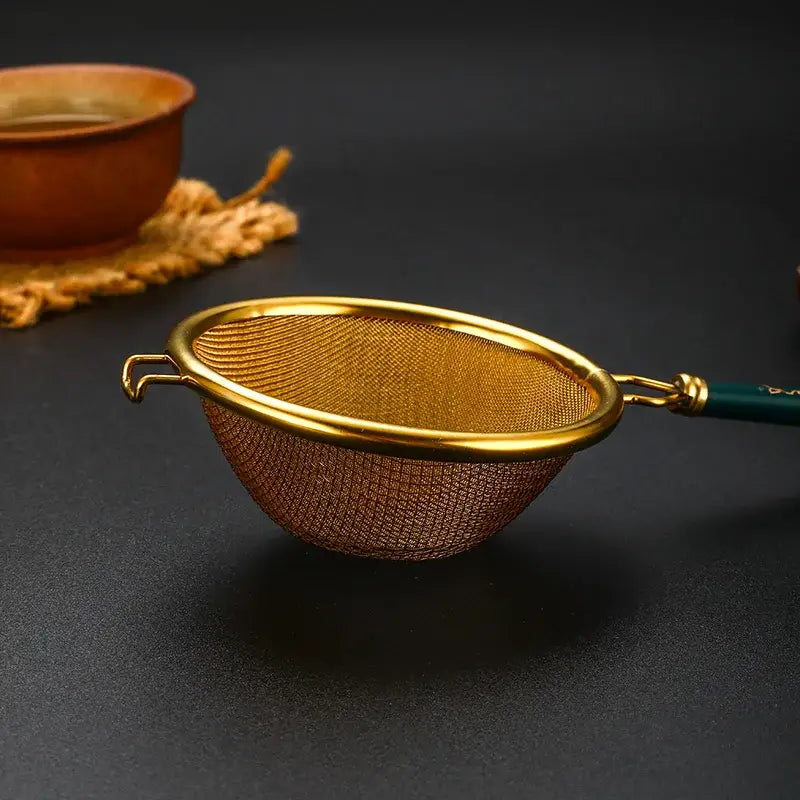 Tea strainer resting on a cup of loose leaf tea
