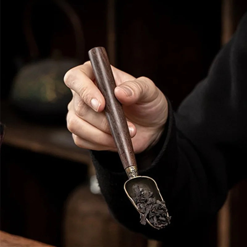 Close-up of natural wood grain on vintage loose leaf tea spoon handle