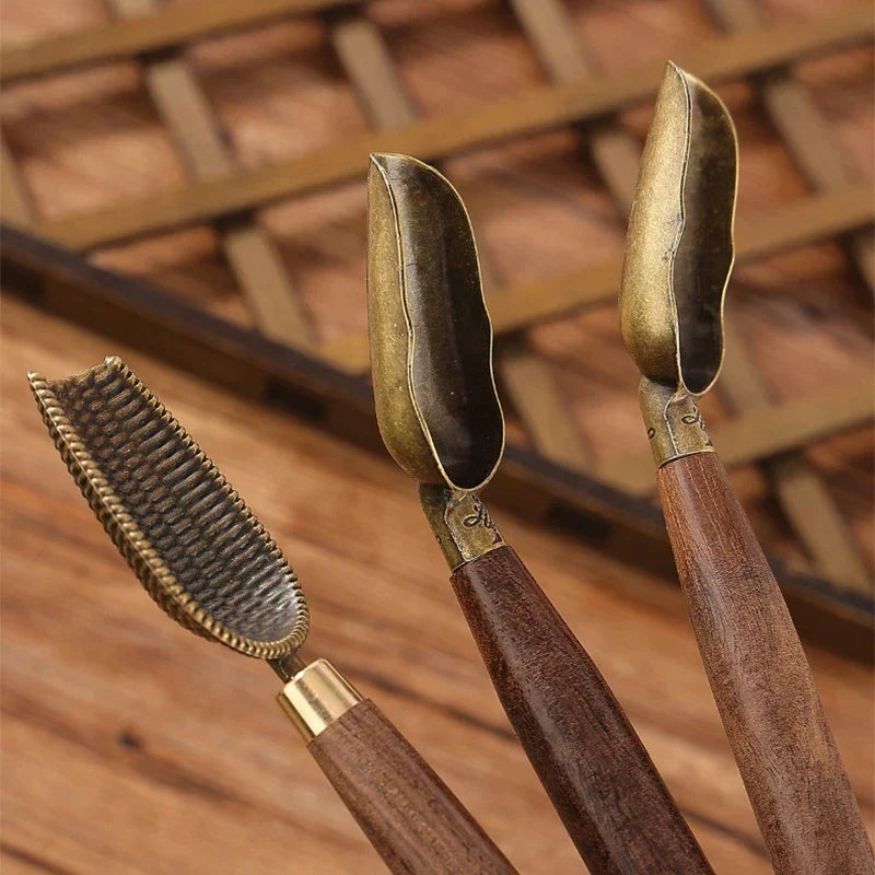 Chiseled finish vintage wooden tea spoon showing carved handle grooves