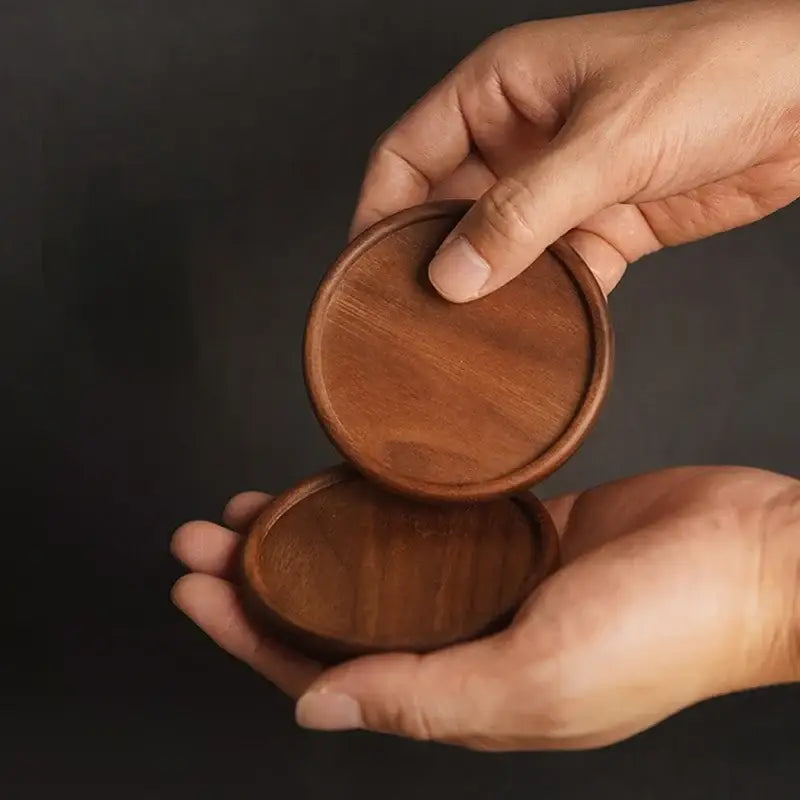 Dark walnut wood teacup saucer set on table