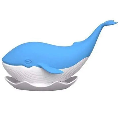 Silicone whale tea strainer clipped on rim of mug steeping loose leaf tea