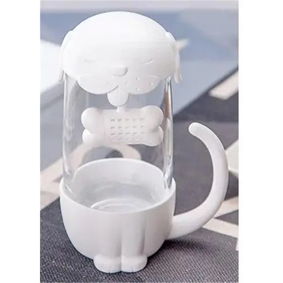 White cat glass tea cup with loose-leaf tea steeping inside