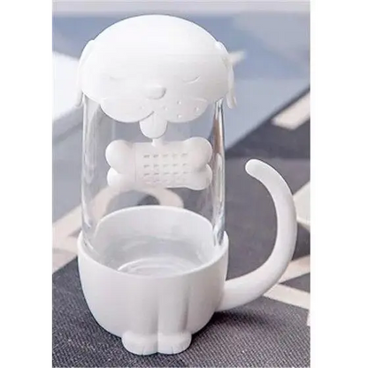 White cat glass tea cup with loose-leaf tea steeping inside