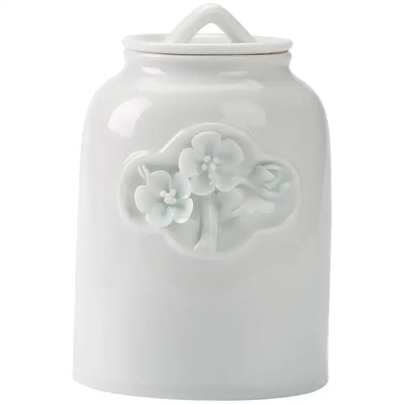 White ceramic tea canister in cozy morning kitchen light