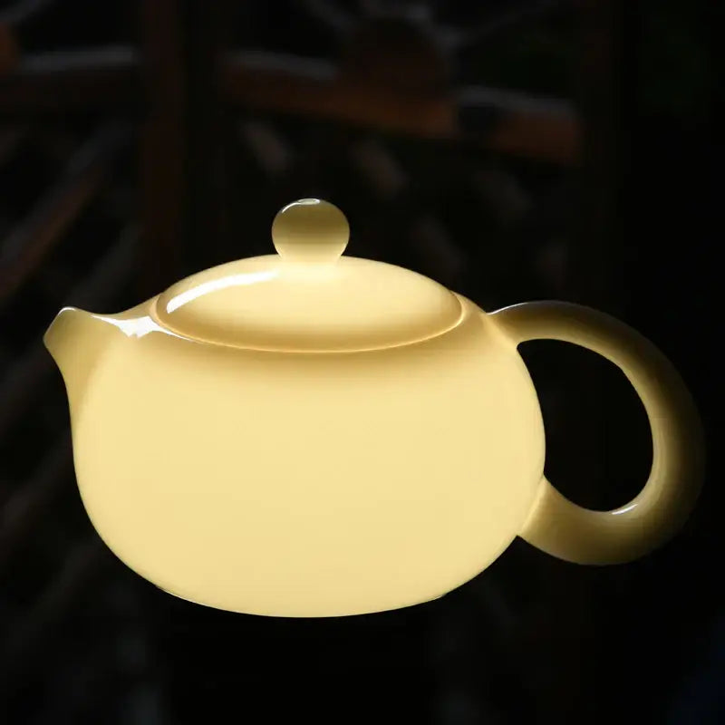 Elegant white ceramic teapot close up