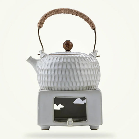 White Chinese ceramic teapot with braided rope handle, full product view on plain background