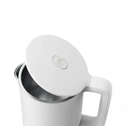 Opening the lid of white electric kettle