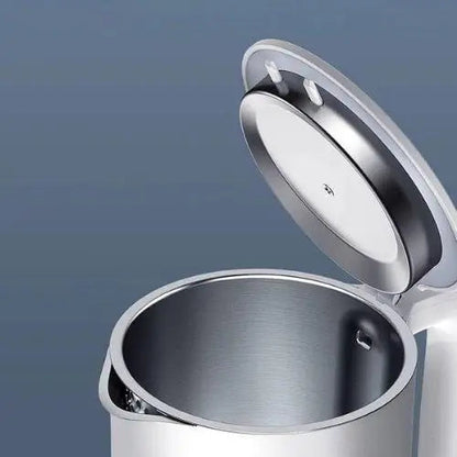 Stainless steel interior of white electric kettle