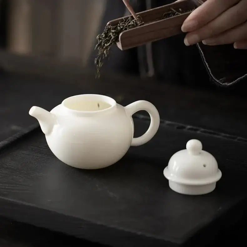 White porcelain teapot 120ml on table