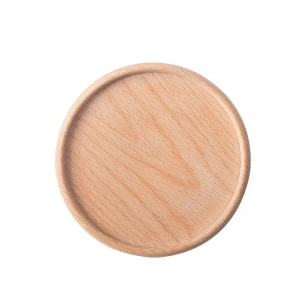Natural wood coasters with a teapot in background