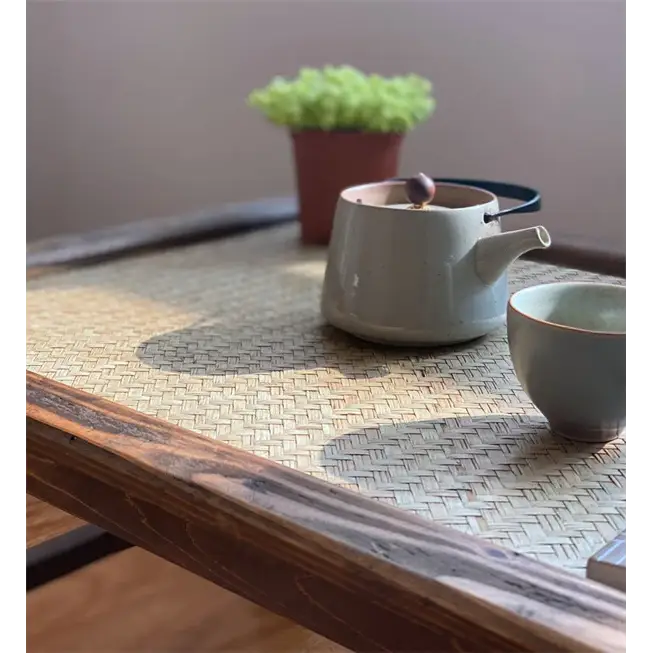 Folding tea tray with teapot and cups on top