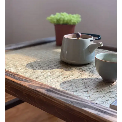 Folding tea tray with teapot and cups on top