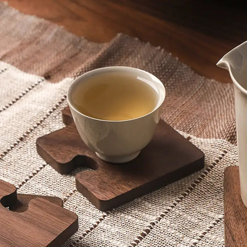 Puzzle coasters arranged as trivet for teapot