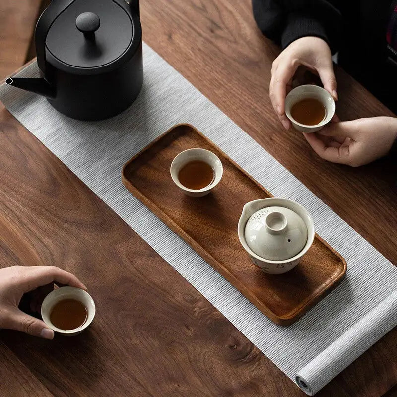 Wooden tea tray with teapot and cups