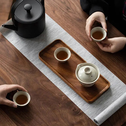 Wooden tea tray with teapot and cups