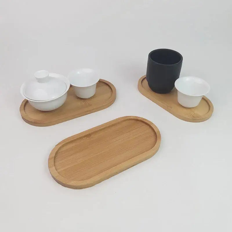 Wooden tea tray with cups and saucers