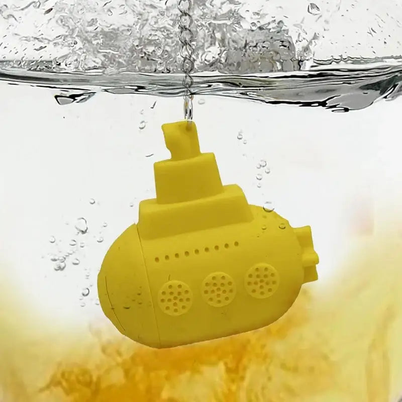 Close-up of a yellow submarine tea infuser made of silicone