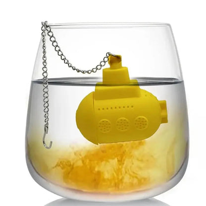 Yellow submarine tea infuser in a person's hand showing size