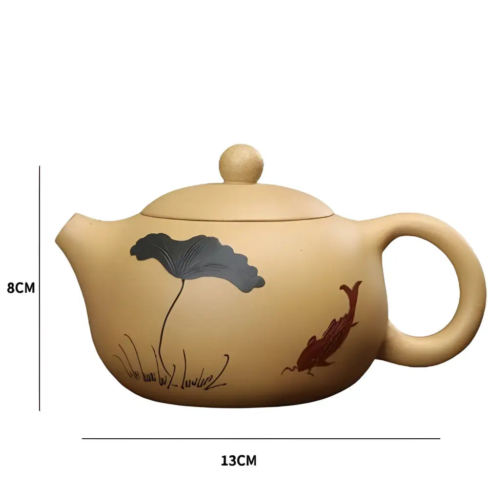 Yixing clay teapot shown with size reference next to hand