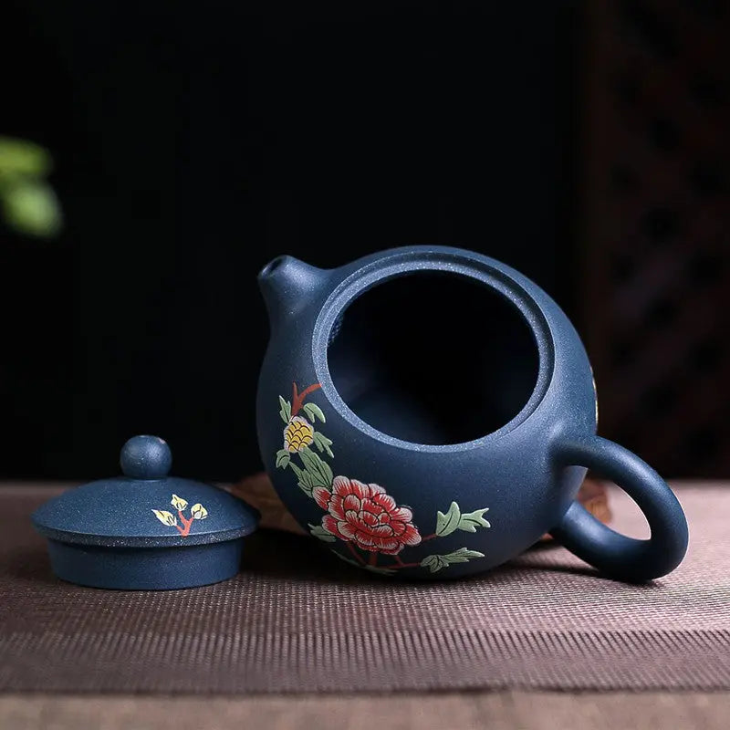 Yixing teapot blue flower 230ml with lid open, showing unglazed interior