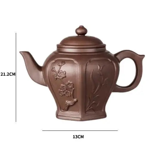 Yixing clay teapot with flower design showing size