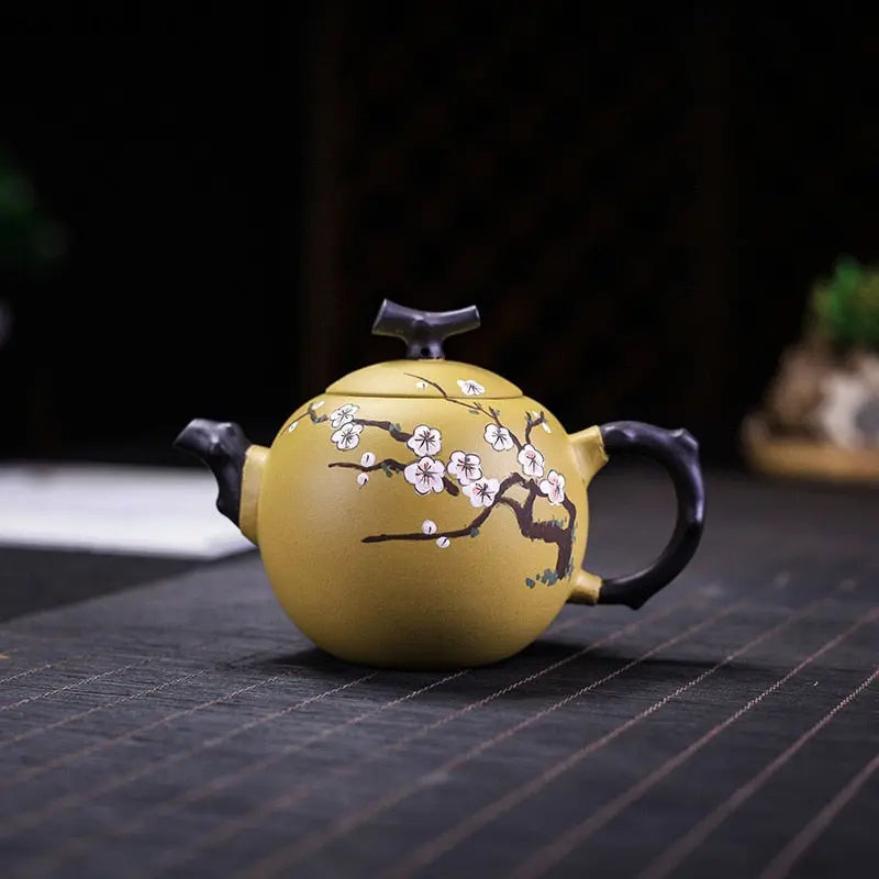 Yixing clay teapot cherry blossom motif 250ml front view showing hand-carved branches