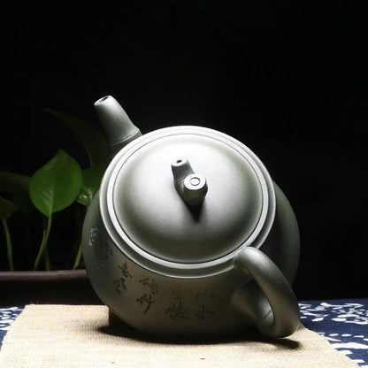Close-up of hand-brushed Chinese calligraphy on Yixing clay teapot surface